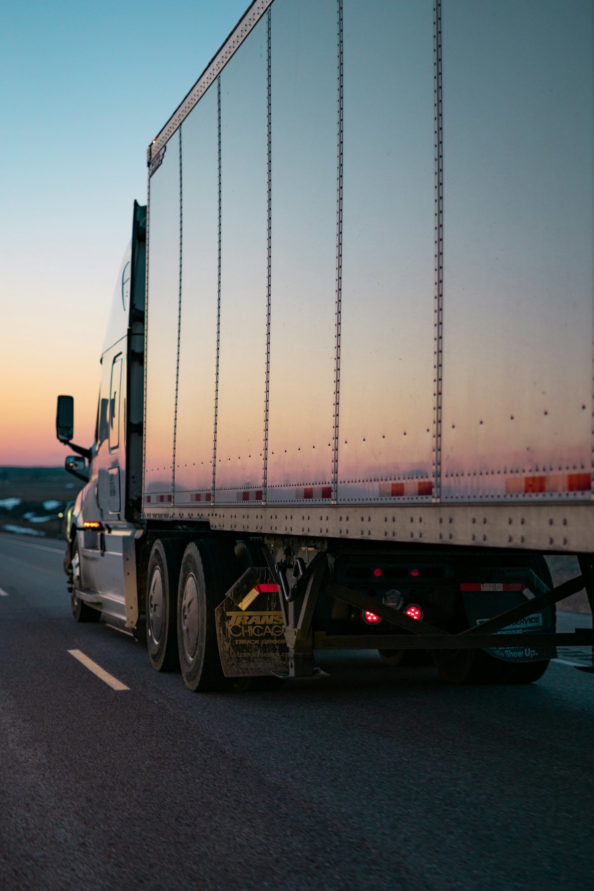 Haulwex truck on the road at sunset